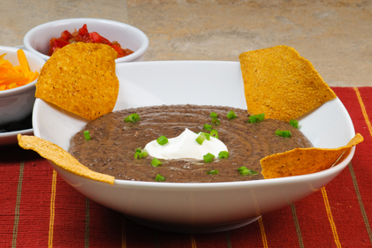 Black bean soup with hot roast pepper cream