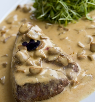 Prime steak with a creamy mushroom sauce