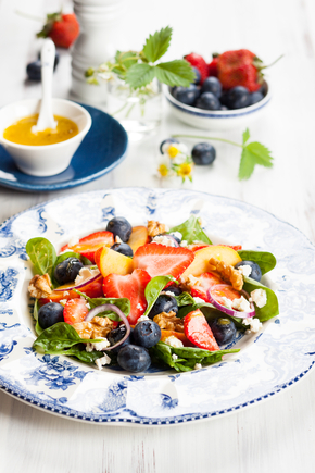Goats cheese with fruit salad and walnuts