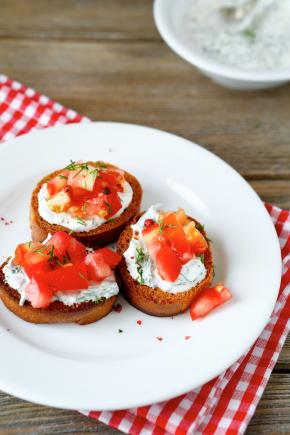 Garlic pizza breads with tomatoes and mozzarella