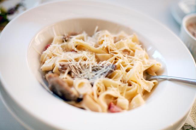 Creamy sauce with sirloin steak over fettuccine 